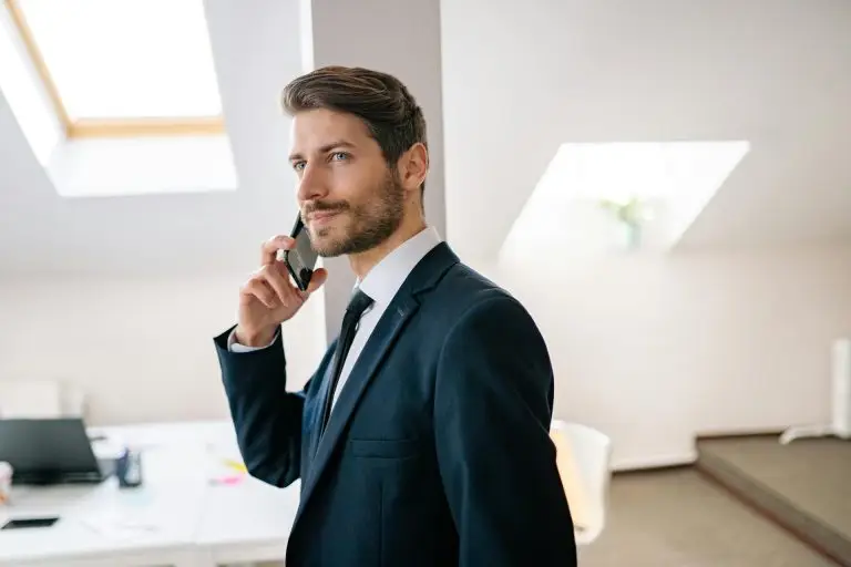 Businessman in a blue suit on the phone